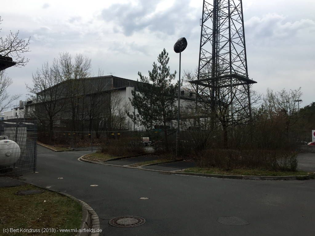 Telecommunications tower and hangar.