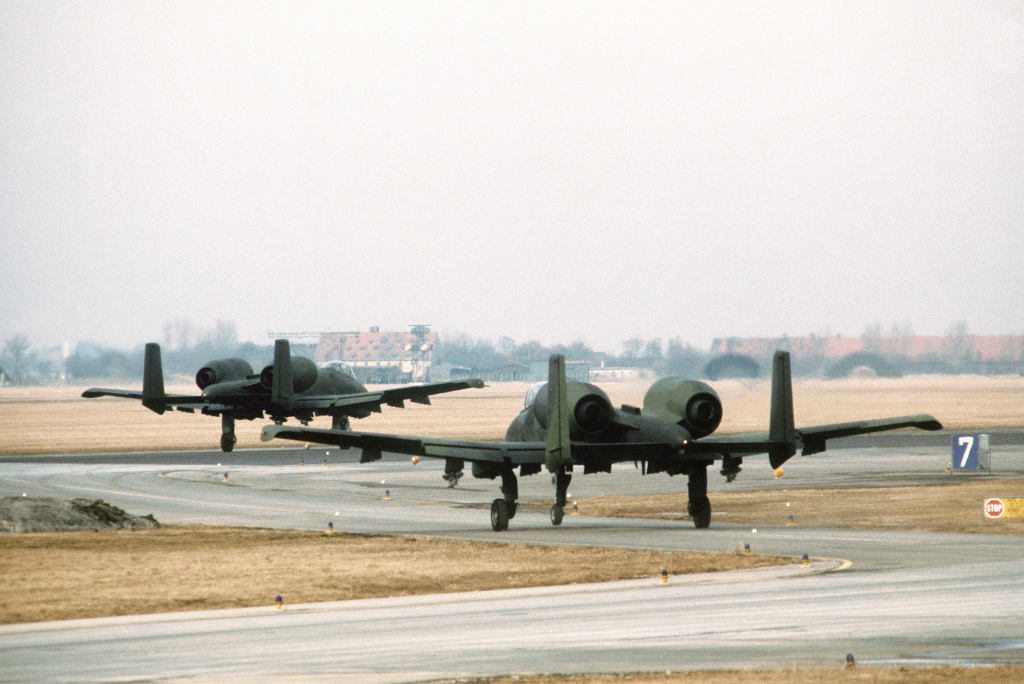 Two A­10 aircraft taxi out to the runway at Lechfeld airfield